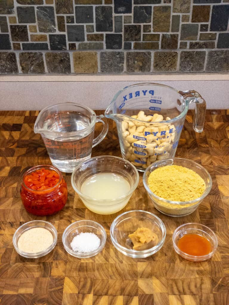 ingredients for dairy-free cheese sauce on cutting board