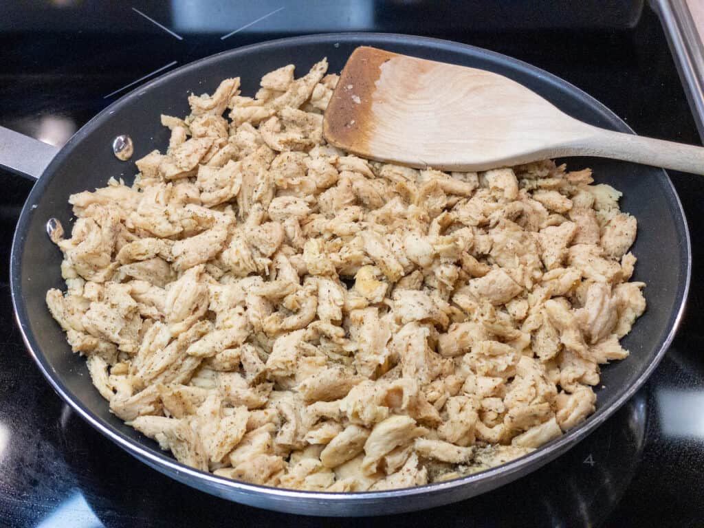 soy curls in nonstick pan with spices stirred in