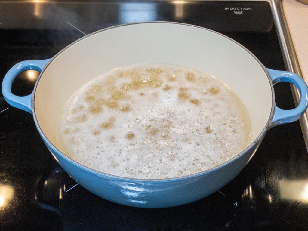 brown rice and water in 4 quart pot on stove coming to a boil.